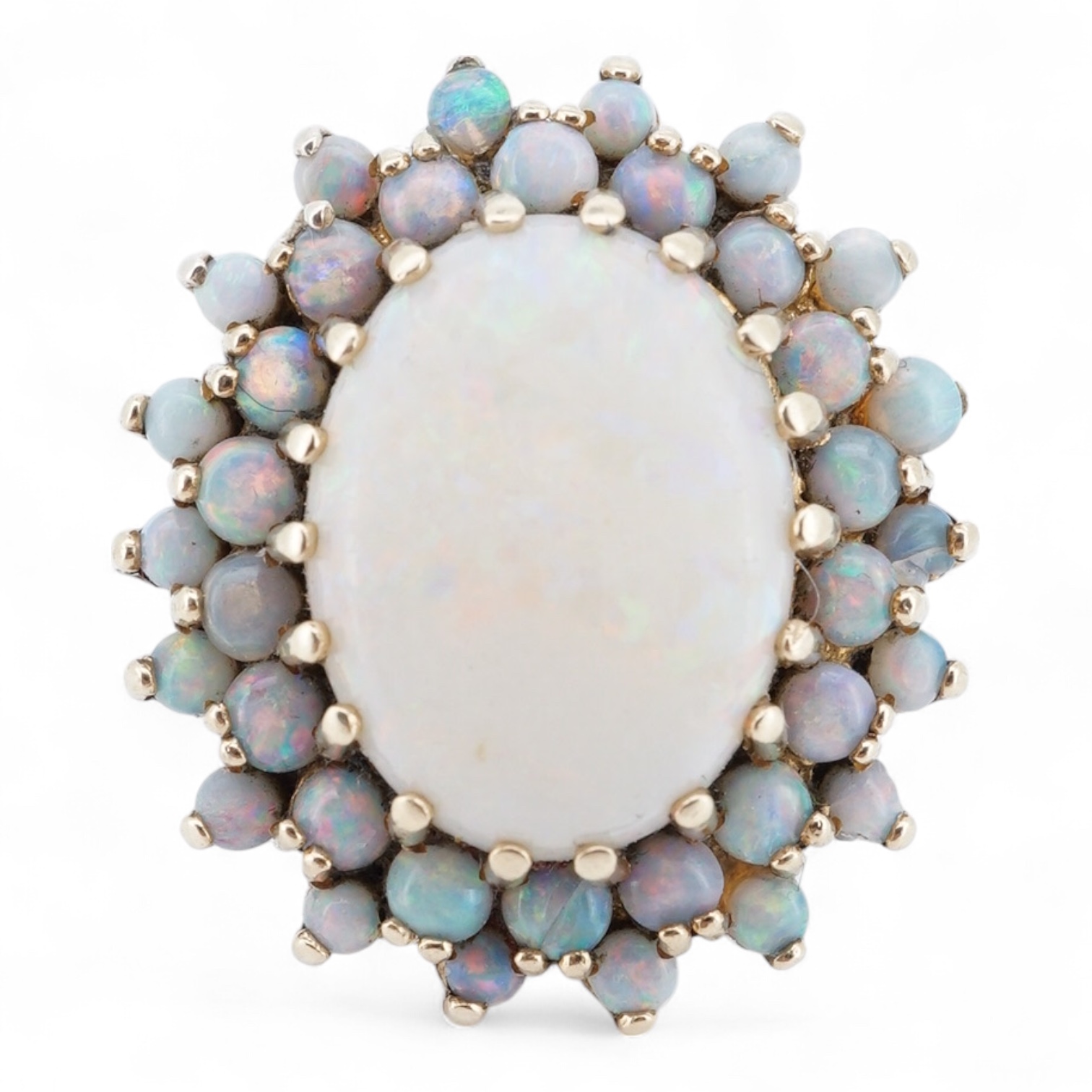 An early 1970's 9ct gold and opal cluster set dress ring, size O, gross weight 9 grams.
